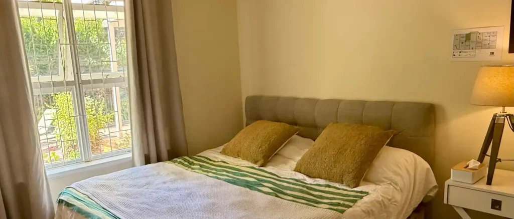 bed by the window