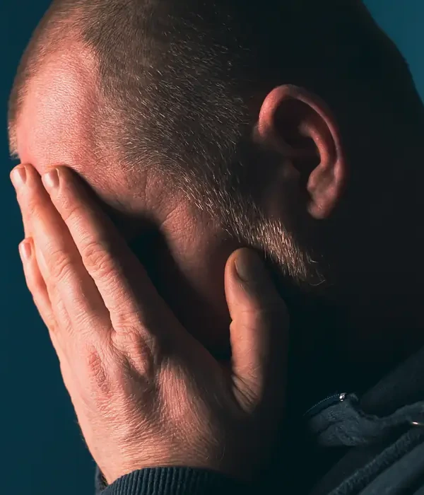 liberty-mental-health-man-hands-face-page