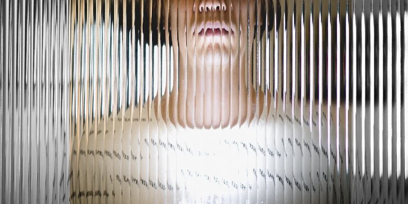 woman behind curtain