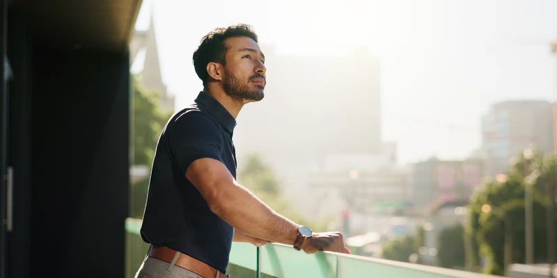 man standing on balcony